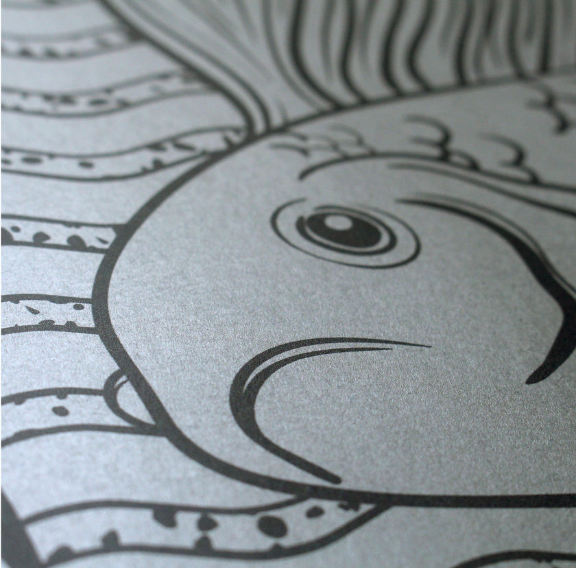 Detail of Koi Fish in black in on silver paper.